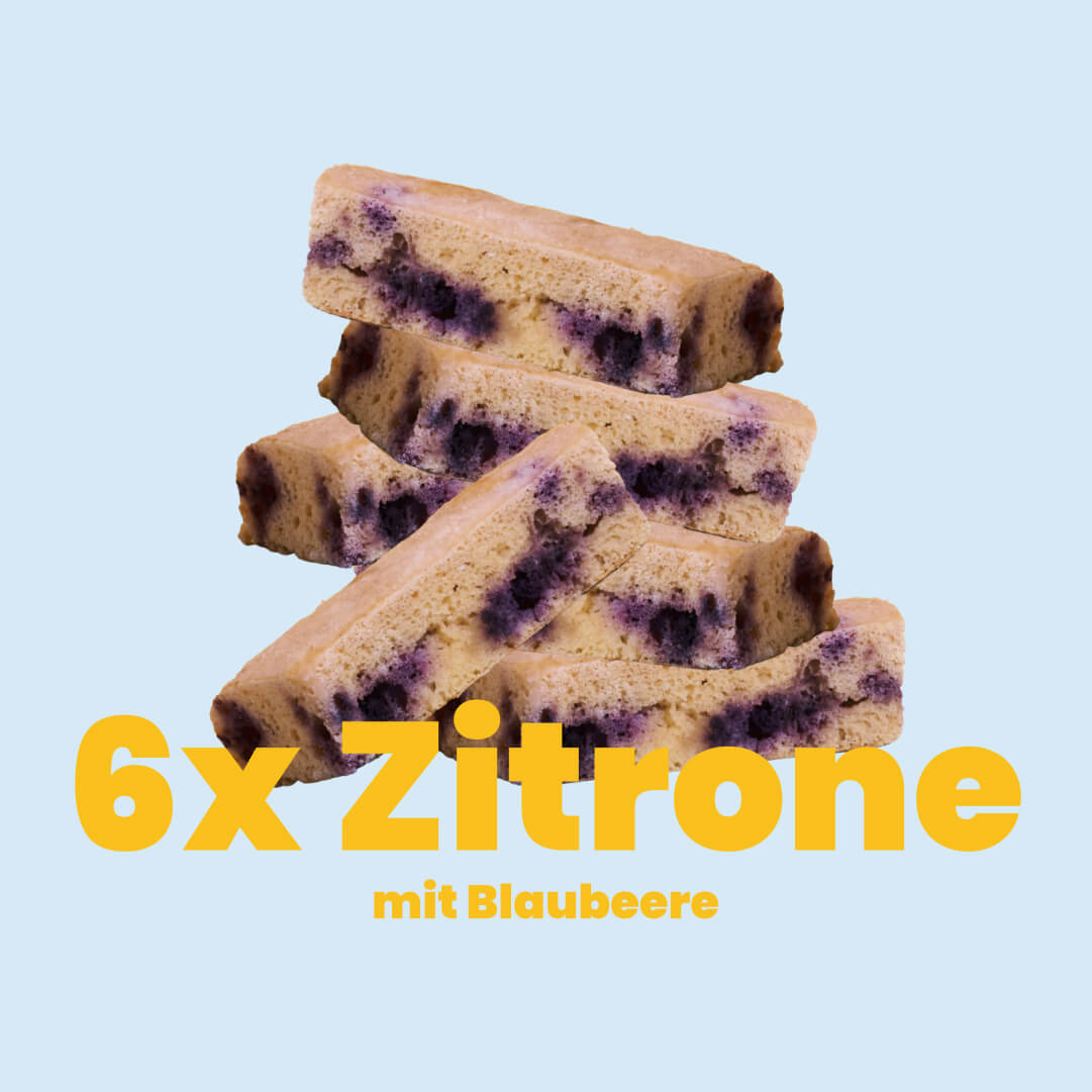 6er-Paket Zitrone-Blaubeer: sechs Kuchen der Sorte Zitrone-Blaubeere gestapelt, darunter steht: 6x Zitrone mit Blaubeere – Kuchen ohne Mehl und Zucker